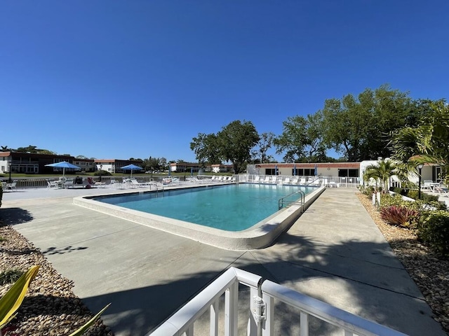 1225 NW 21st St NW Unit 15-1505, Stuart, FL 34994 - community pool with a patio area