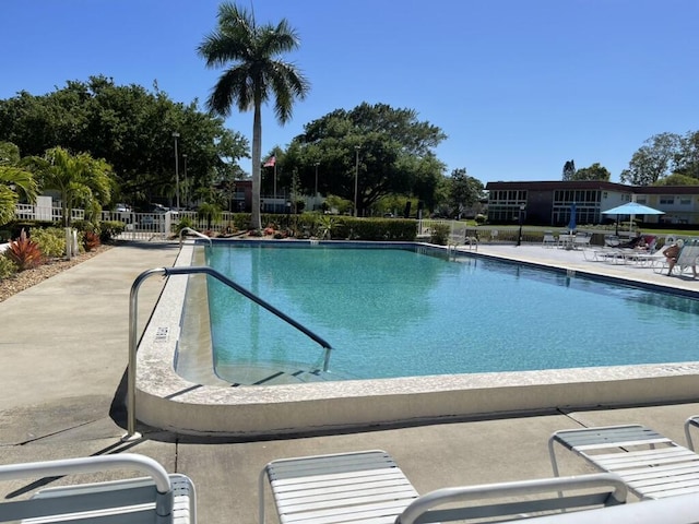 1225 NW 21st St NW Unit 15-1505, Stuart, FL 34994 - community pool with a patio