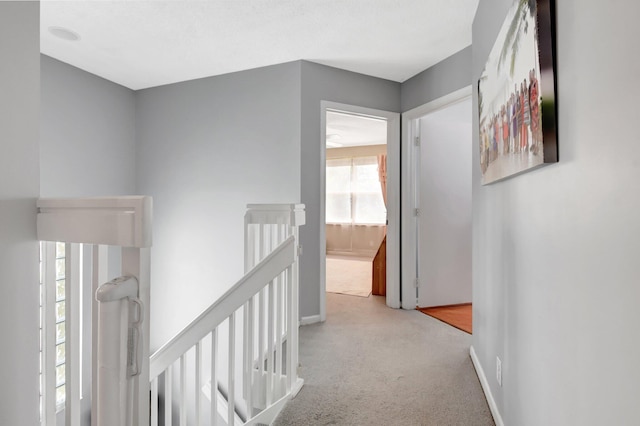 7989 Lakewood Cove Ct, Lake Worth, FL 33467 - corridor with an upstairs landing, carpet flooring, and baseboards