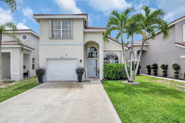 7989 Lakewood Cove Ct, Lake Worth, FL 33467 - mediterranean / spanish-style home featuring a tiled roof, a front yard, an attached garage, driveway, and stucco siding