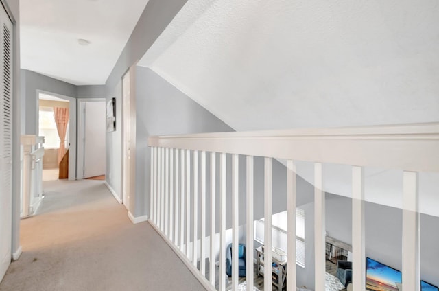 7989 Lakewood Cove Ct, Lake Worth, FL 33467 - hallway featuring carpet flooring, baseboards, and vaulted ceiling