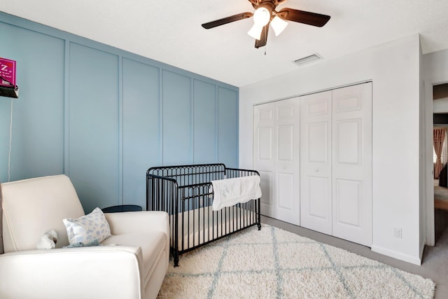 7989 Lakewood Cove Ct, Lake Worth, FL 33467 - bedroom featuring light carpet, a closet, ceiling fan, and baseboards
