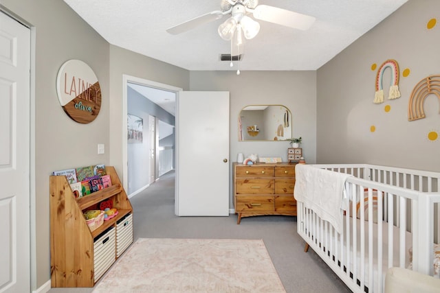 7989 Lakewood Cove Ct, Lake Worth, FL 33467 - carpeted bedroom featuring a nursery area and ceiling fan