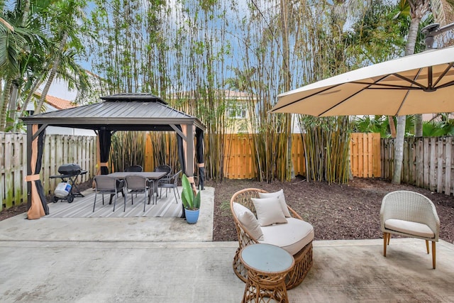 7989 Lakewood Cove Ct, Lake Worth, FL 33467 - fenced backyard featuring a gazebo, outdoor dining space, a grill, and a patio area