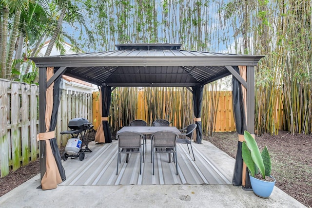 7989 Lakewood Cove Ct, Lake Worth, FL 33467 - fenced backyard featuring a gazebo, outdoor dining space, and a grill