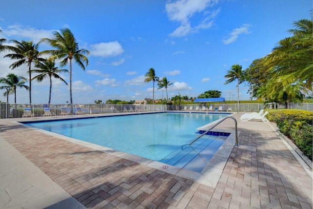 7989 Lakewood Cove Ct, Lake Worth, FL 33467 - community pool featuring a patio