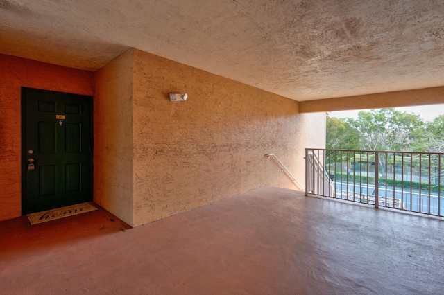 3870 Lyons Rd Unit 308-8, Coconut Creek, FL 33073 - entrance to property featuring stucco siding and an outdoor pool