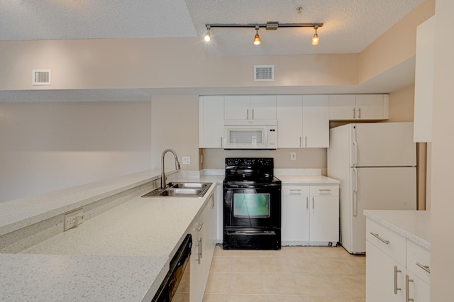 3870 Lyons Rd Unit 308-8, Coconut Creek, FL 33073 - kitchen featuring black appliances, a sink, light countertops, white cabinets, and a textured ceiling