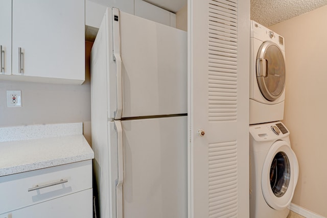 3870 Lyons Rd Unit 308-8, Coconut Creek, FL 33073 - laundry area with estacked washer and dryer