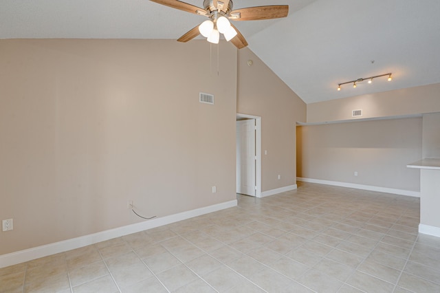 3870 Lyons Rd Unit 308-8, Coconut Creek, FL 33073 - spare room with ceiling fan, high vaulted ceiling, light tile patterned floors, and baseboards