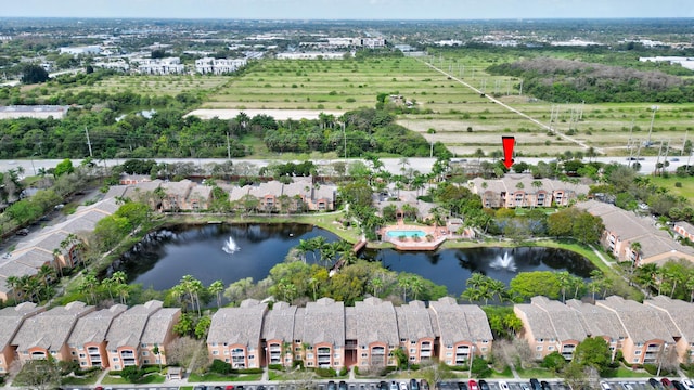 3870 Lyons Rd Unit 308-8, Coconut Creek, FL 33073 - aerial view of property and surrounding area featuring a large body of water and rural landscape