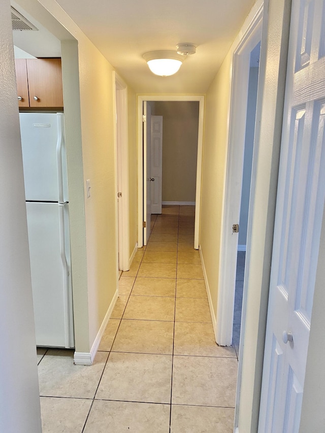 405 W Executive Center Dr Unit 208, West Palm Beach, FL 33401 - hall featuring light tile patterned flooring and baseboards