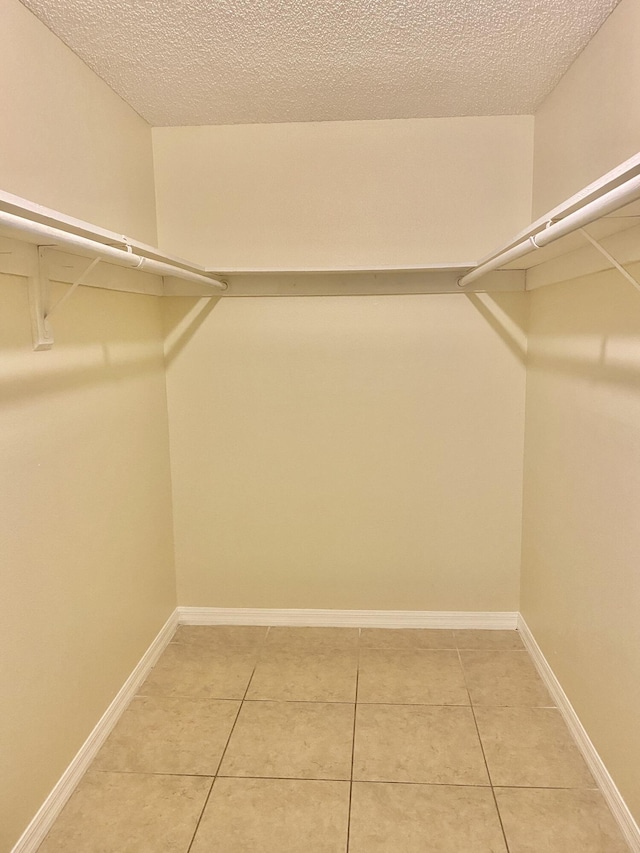 405 W Executive Center Dr Unit 208, West Palm Beach, FL 33401 - walk in closet with light tile patterned floors