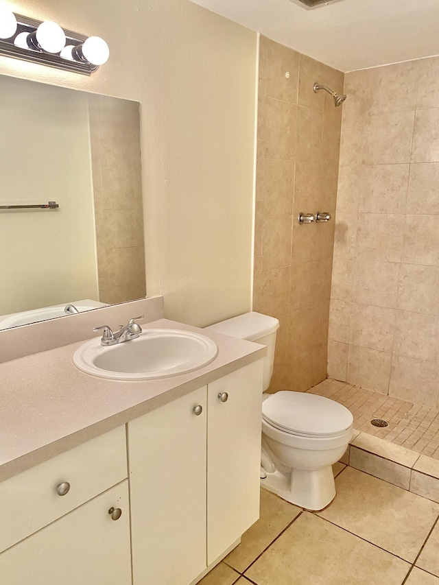 405 W Executive Center Dr Unit 208, West Palm Beach, FL 33401 - full bathroom with a tile shower, tile patterned flooring, vanity, and toilet