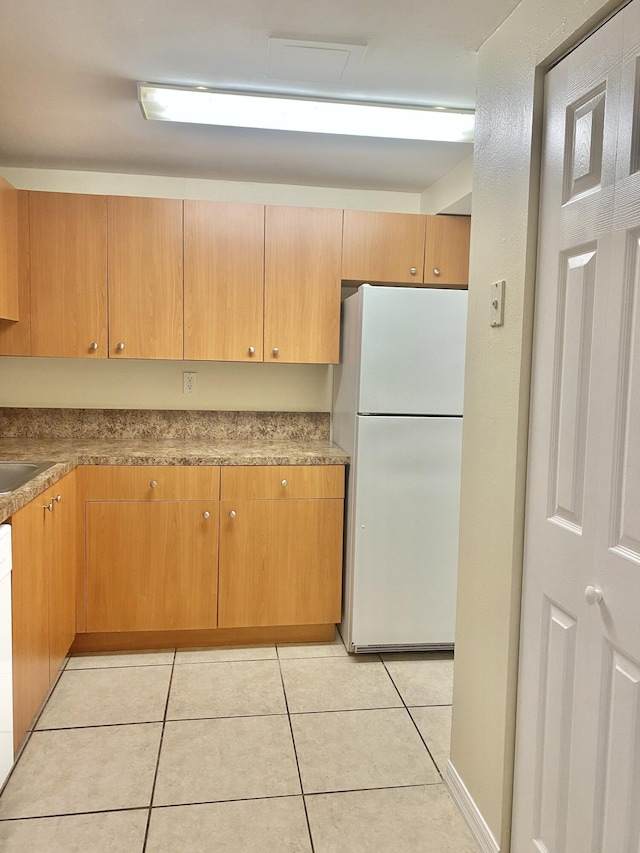 405 W Executive Center Dr Unit 208, West Palm Beach, FL 33401 - kitchen featuring white appliances and light tile patterned floors