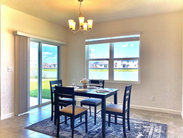 10789 SW Cremona Way, Port Saint Lucie, FL 34987 - dining room with a chandelier and baseboards