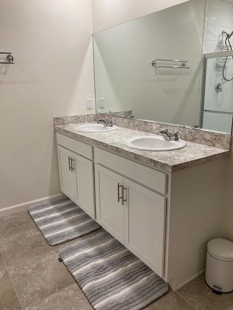 10789 SW Cremona Way, Port Saint Lucie, FL 34987 - full bath featuring double vanity and an enclosed shower