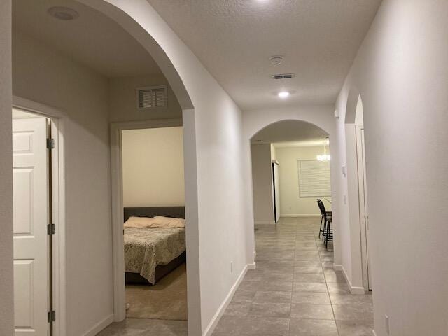 10789 SW Cremona Way, Port Saint Lucie, FL 34987 - hall with light tile patterned floors and arched walkways