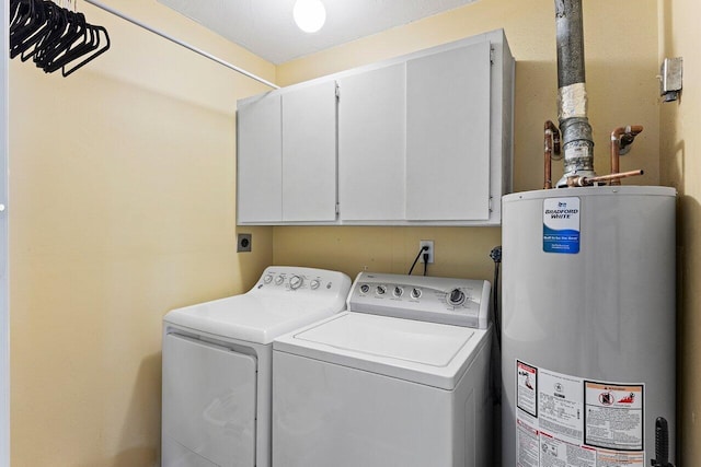 3523 Pine Haven Cir, Boca Raton, FL 33431 - washroom with water heater, cabinet space, and separate washer and dryer
