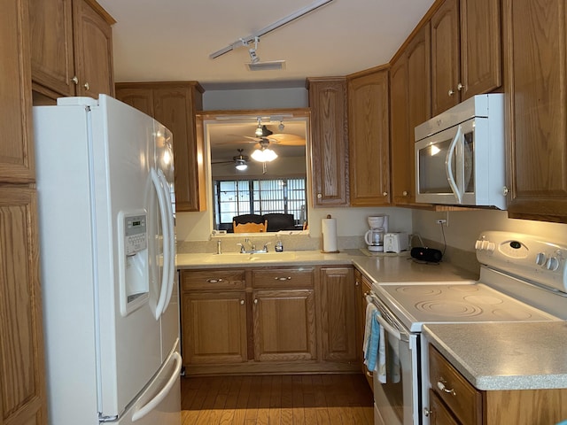 6004 Indrio Rd Unit 2, Fort Pierce, FL 34951 - kitchen featuring white appliances, brown cabinetry, a ceiling fan, light countertops, and track lighting