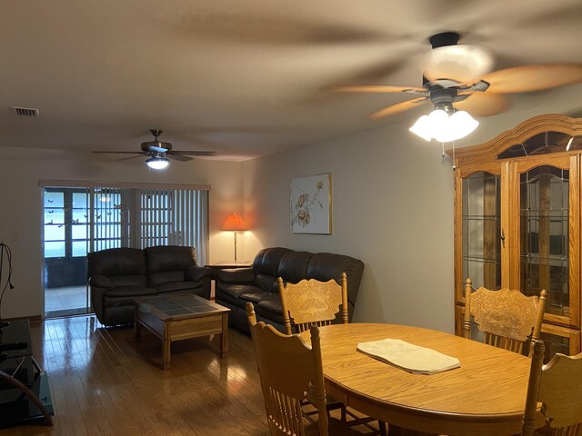 6004 Indrio Rd Unit 2, Fort Pierce, FL 34951 - dining area with ceiling fan and hardwood / wood-style floors