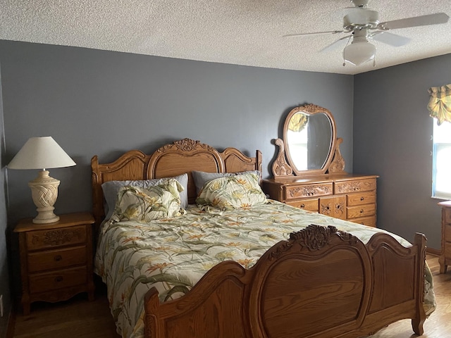 6004 Indrio Rd Unit 2, Fort Pierce, FL 34951 - bedroom featuring wood finished floors, a textured ceiling, and ceiling fan