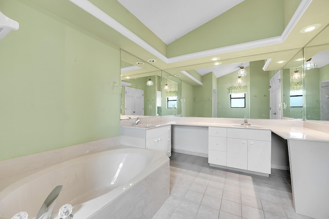 654 SW Kayak Ave, Port Saint Lucie, FL 34953 - full bathroom featuring vaulted ceiling, a garden tub, vanity, tile patterned flooring, and recessed lighting