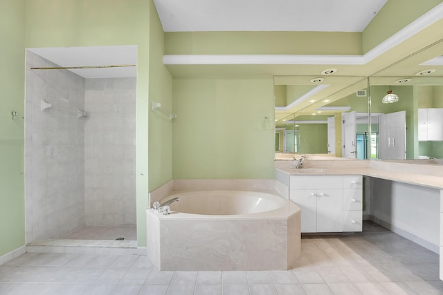 654 SW Kayak Ave, Port Saint Lucie, FL 34953 - bathroom featuring a bath, vanity, tiled shower, and tile patterned flooring