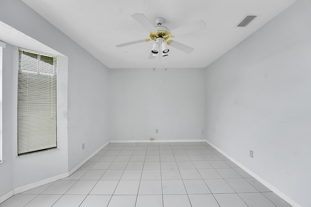 654 SW Kayak Ave, Port Saint Lucie, FL 34953 - empty room featuring ceiling fan, baseboards, and light tile patterned floors