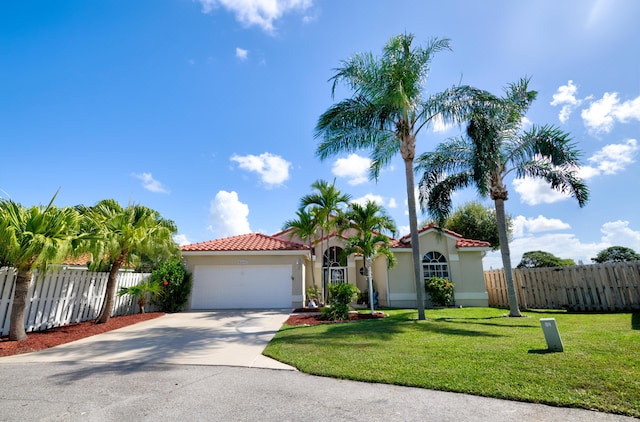 4290 Camrose Ln, West Palm Beach, FL 33417 - mediterranean / spanish house with a garage, driveway, stucco siding, and a tiled roof