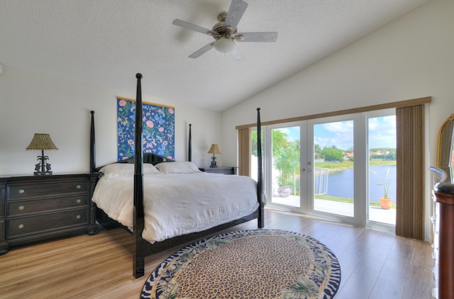 4290 Camrose Ln, West Palm Beach, FL 33417 - bedroom featuring access to exterior, light wood-style flooring, a textured ceiling, a water view, and ceiling fan