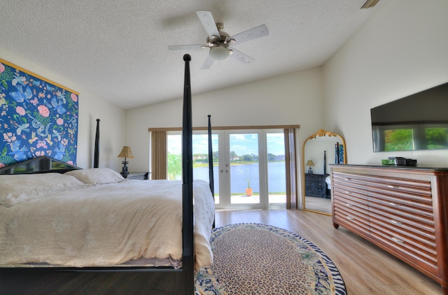 4290 Camrose Ln, West Palm Beach, FL 33417 - bedroom with lofted ceiling, access to exterior, a textured ceiling, wood finished floors, and a ceiling fan