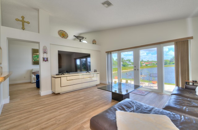 4290 Camrose Ln, West Palm Beach, FL 33417 - living area featuring french doors and light wood-style floors