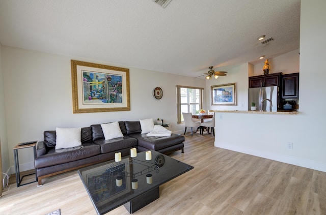 4290 Camrose Ln, West Palm Beach, FL 33417 - living room with a ceiling fan, light wood-type flooring, and a textured ceiling