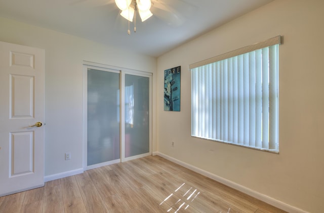 4290 Camrose Ln, West Palm Beach, FL 33417 - unfurnished bedroom featuring wood finished floors, a ceiling fan, and a closet