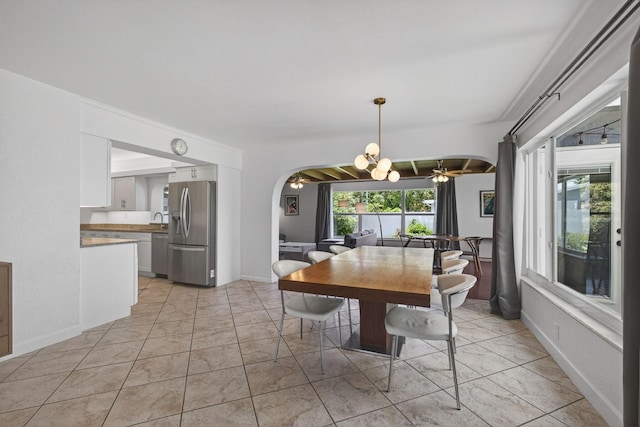 2476 S Florida Mango Rd, West Palm Beach, FL 33406 - dining room featuring arched walkways, a ceiling fan, and a chandelier
