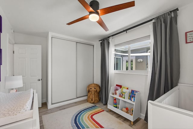 2476 S Florida Mango Rd, West Palm Beach, FL 33406 - bedroom with a closet, light wood-type flooring, and ceiling fan