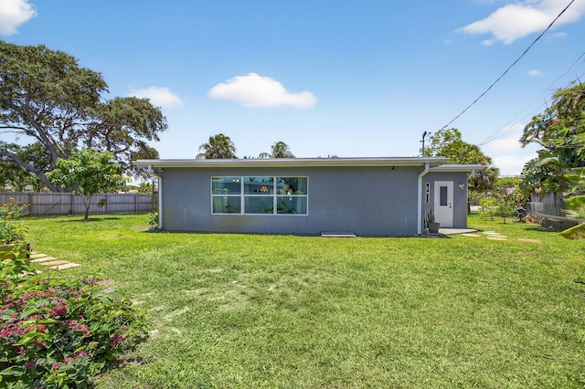2476 S Florida Mango Rd, West Palm Beach, FL 33406 - back of house with stucco siding