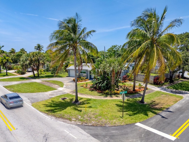 2476 S Florida Mango Rd, West Palm Beach, FL 33406 - obstructed view of property with a front lawn, driveway, and a garage