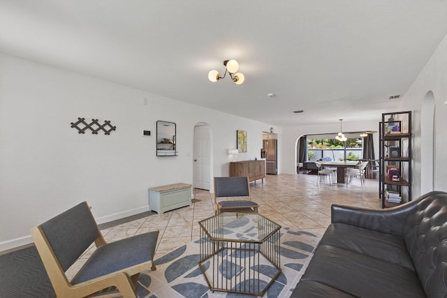 2476 S Florida Mango Rd, West Palm Beach, FL 33406 - living room featuring arched walkways and baseboards