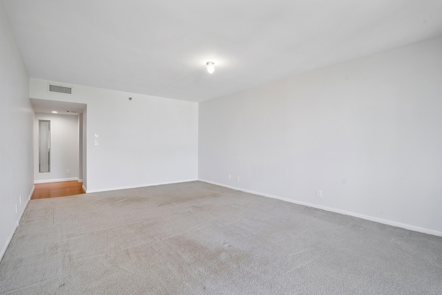 1401 S Ocean Blvd Unit 305, Boca Raton, FL 33432 - unfurnished room featuring carpet and baseboards
