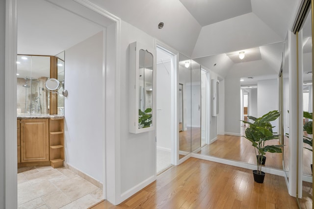 1401 S Ocean Blvd Unit 305, Boca Raton, FL 33432 - bathroom featuring vanity, baseboards, lofted ceiling, and wood finished floors