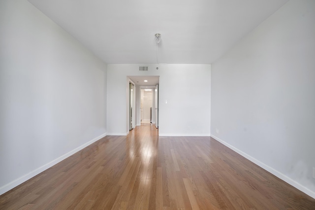 1401 S Ocean Blvd Unit 305, Boca Raton, FL 33432 - unfurnished room featuring baseboards and wood finished floors