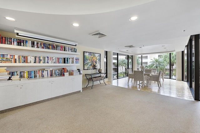 1401 S Ocean Blvd Unit 305, Boca Raton, FL 33432 - sitting room with a wall of windows, recessed lighting, and light colored carpet