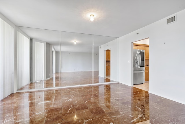 1401 S Ocean Blvd Unit 305, Boca Raton, FL 33432 - empty room with light marble finish floors