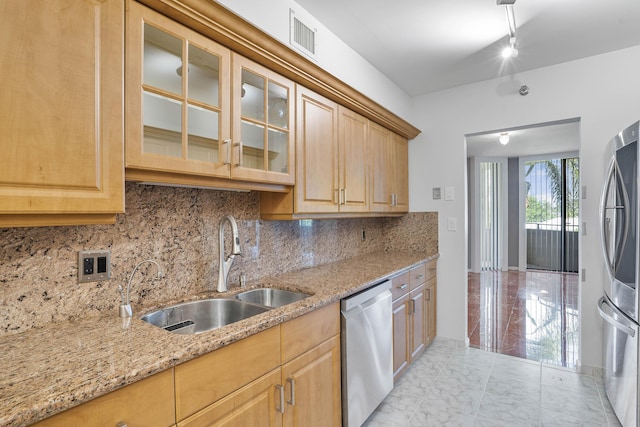 1401 S Ocean Blvd Unit 305, Boca Raton, FL 33432 - kitchen featuring appliances with stainless steel finishes, a sink, light marble finish flooring, and backsplash