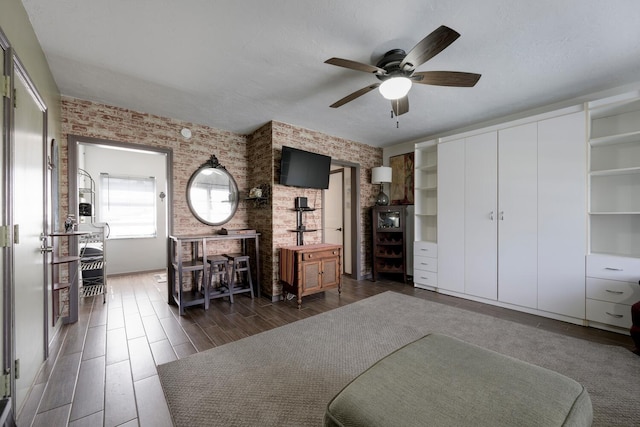 101 S Golfview Rd Unit 15, Lake Worth Beach, FL 33460 - living room with brick wall, ceiling fan, and wood finish floors