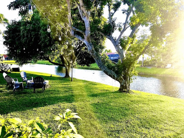 9823 NE Sun Pointe Dr, Boynton Beach, FL 33437 - surrounding community featuring a water view and a lawn