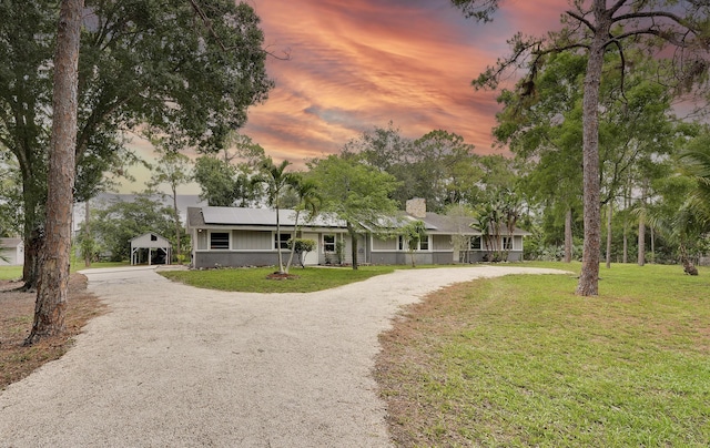 13655 N 68th St N, West Palm Beach, FL 33412 - single story home featuring curved driveway, covered porch, and a front yard