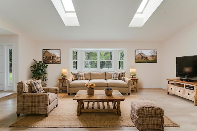 13655 N 68th St N, West Palm Beach, FL 33412 - living area featuring a skylight, light wood finished floors, and lofted ceiling